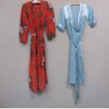 A vintage red floral silk lady's dressing gown and a plain mid blue silk crepe dressing gown wih