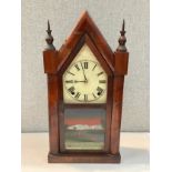 A circa 1900 mahogany cased cathedral style clock, glazed scene of Buckingham Palace, finial detail,