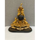 A French ormolu figural mantel clock of globe form with Olivant & Botsford of Paris movement, highly
