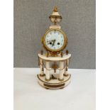 A 19th Century French alabaster and ormolu mantel clock with Arabic dial and column detail, sun-form