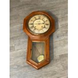An oak cased American drop dial wall clock with octagonal case, second subsidiary dial, with