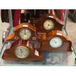 Four various Edwardian mantel clocks with marquetry inlay