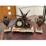 An early 20th Century French bronzed spelter clock garniture with angel musician surmounted, flanked