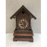An early-mid 20th Century cuckoo mantel clock with pierced and fretwork detail, Roman dial, 52cm