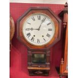 A circa 1900 walnut octagonal cased 8 day drop dial wall clock with Roman dial, moulding detail,