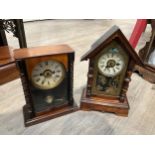 Two early 20th Century American mantel clocks, one with gilt painted glass door