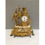 A late 19th Century French figural mantel clock with flag bearer figure, 45cm tall, loose foliage