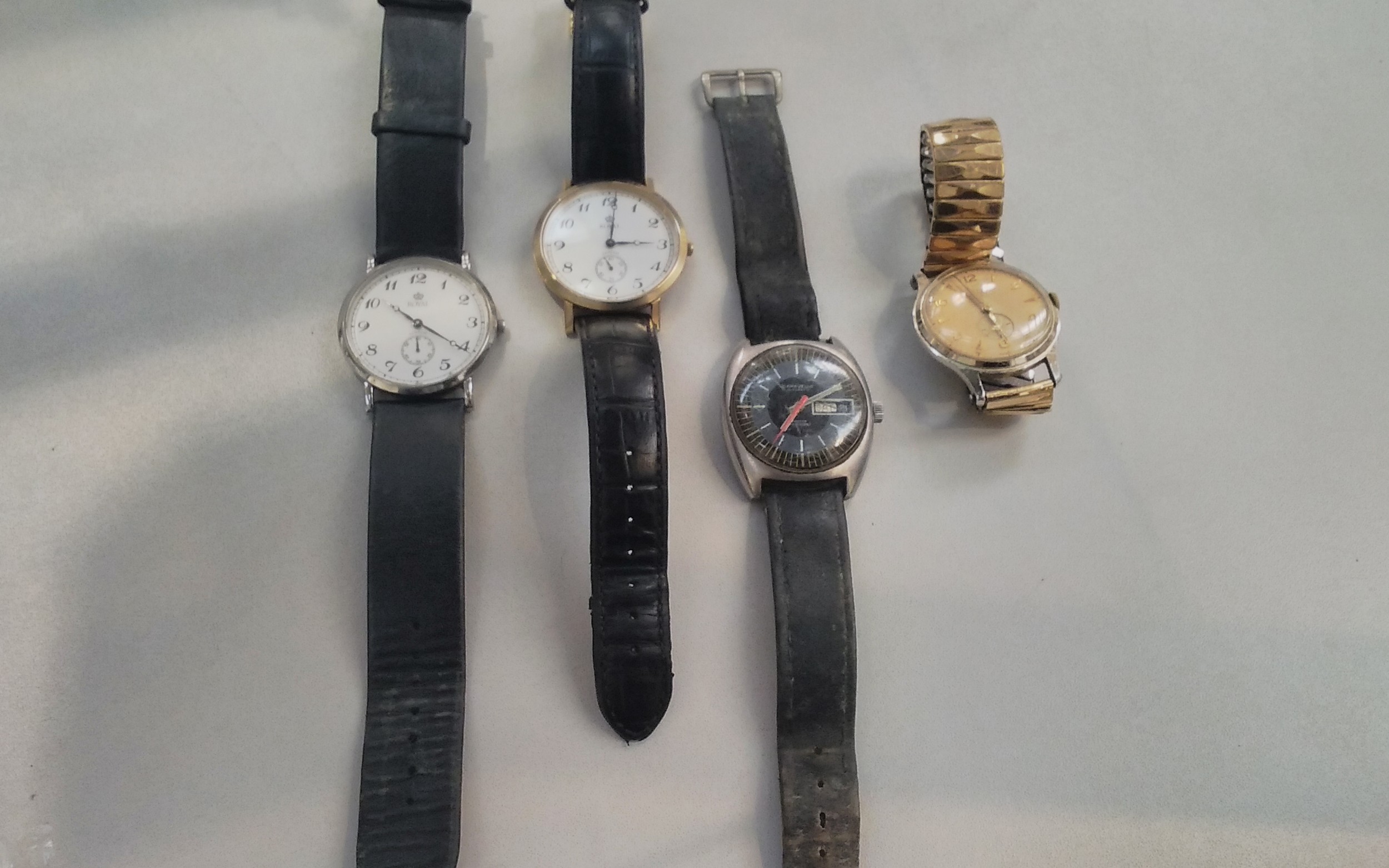Two vintage wristwatches including Smiths Empire and Caravelle, together with two modern examples (