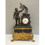 A late 19th Century mantel clock, the bronzed spelter top with flag bearer beside enamelled face (