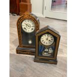 Two early 20th Century American mantel clocks, one with Green Man Mask detail, the other with cat in