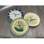 Seven 20th Century tinplate clocks including Smiths