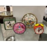 Four mid century pictorial alarm clocks, three Disney themed including Mickey, Minnie and Donald