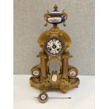A 19th Century French ormolu mantel clock of Architectural form with Sevres style porcelain face