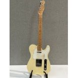A Fender Squier Tele (Telecaster) electric guitar, made in China, cream body, serial number
