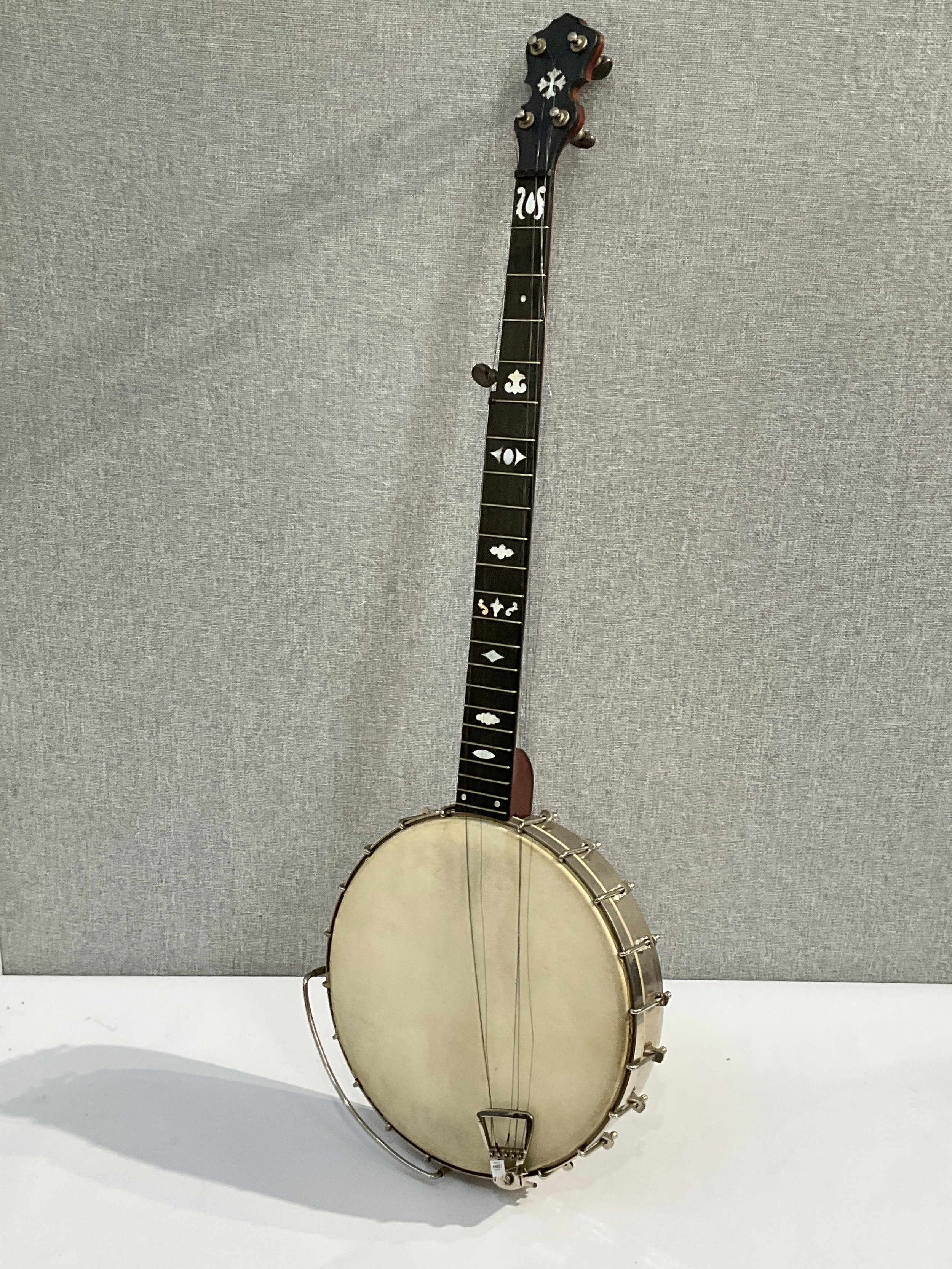A Clifford Essex Co. Of Bond Street, London banjo circa 1910-20, open back with mother of pearl
