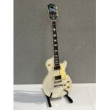 A Sheridan Les Paul style electric guitar with white body and AMG twin coil pickups, soft case