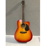 An Encore CEA255R electro acoustic guitar with sunburst body, soft case