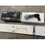 A Shure SM58 vocal microphone, boxed, together with a microphone stand (2)