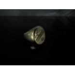 A 9ct gold signet ring, half engraved, set with a small diamond in star setting. Size V, 6.2g