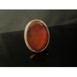 A Victorian gold ring with oval cornelian carved intaglio of a bearded gentleman, unmarked. Size