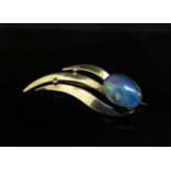 A gold brooch set with an oval opal stamped 9ct , 4.1g