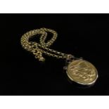 An 1885 gold sovereign in loose pendant mount, hung on a gold belcher chain stamped 9ct, 15.7g total