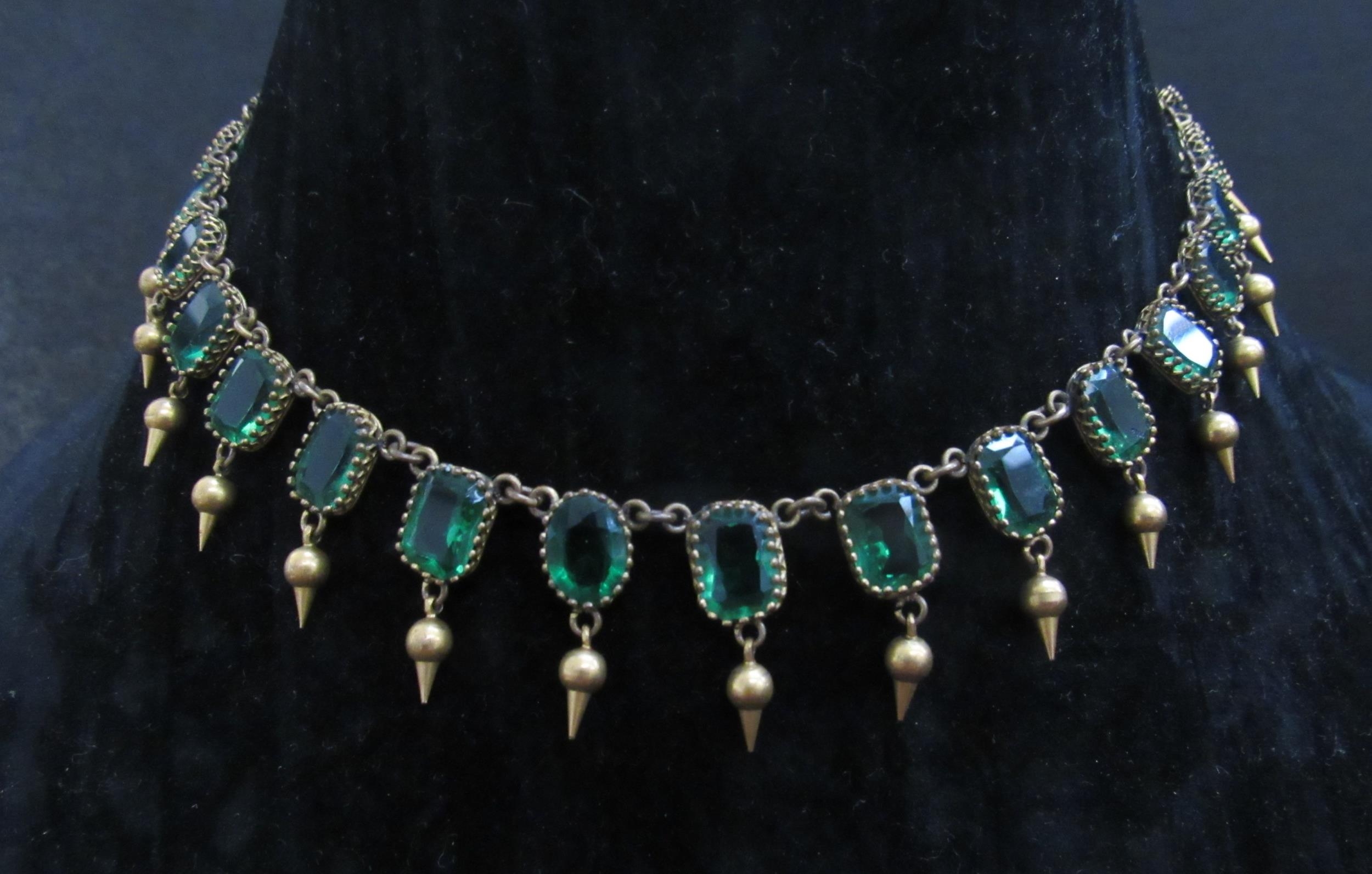 A riviere necklace set with emerald green paste stones each hung with pointed drop, gilt metal, - Image 2 of 4