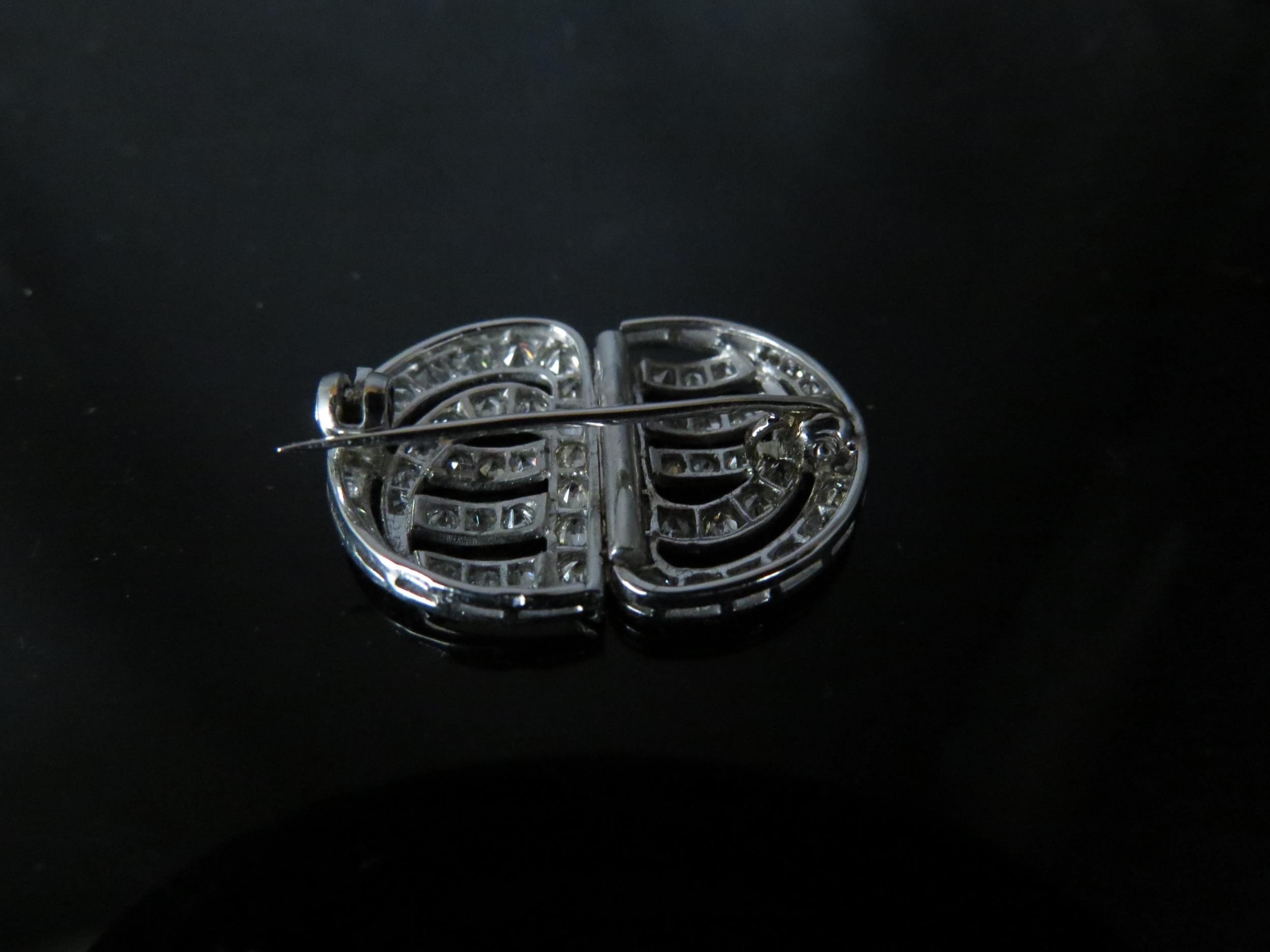 An Art Deco diamond encrusted brooch, formally a pair of clips, unmarked platinum, 2.5cm x 1.9cm, 5g - Image 2 of 2