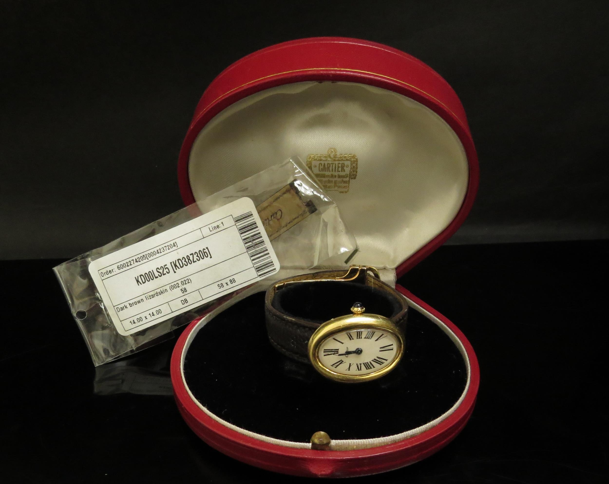 A Cartier "Baignoire" lady's wristwatch, 18ct gold case, Roman numerated oval dial with a sapphire - Image 5 of 5