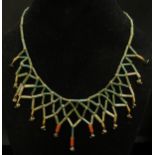 A possibly "Native American" turquoise and coral bead necklace, purchased from Harrods with