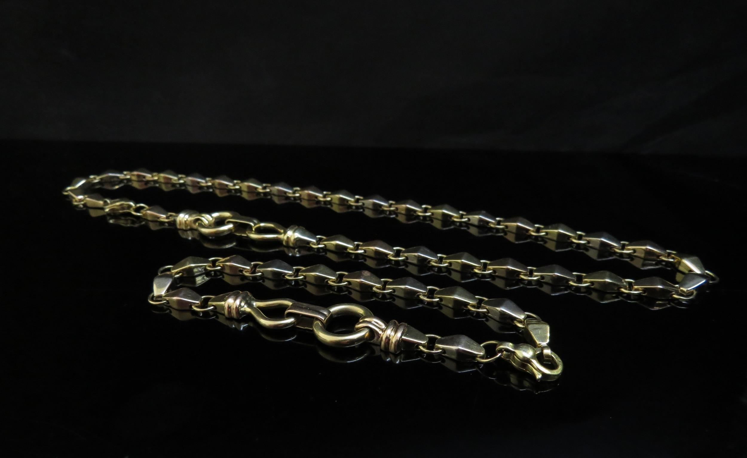 An 18ct gold heavy fancy link necklace, 42cm long and a matching bracelet, 20cm long, 43.6g