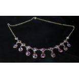 A garnet riviere necklace with nine garnet drops (new clasp 9ct)
