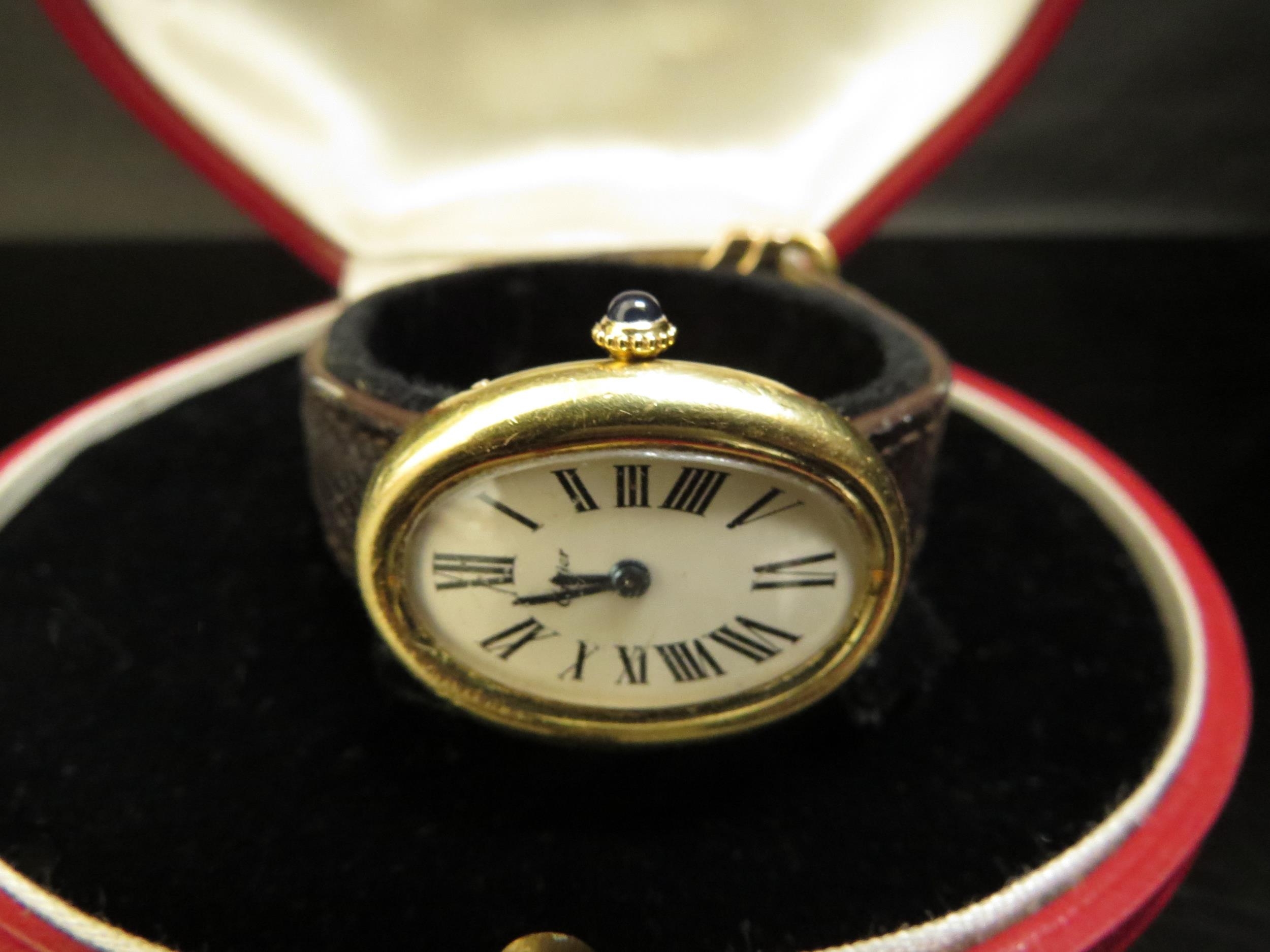 A Cartier "Baignoire" lady's wristwatch, 18ct gold case, Roman numerated oval dial with a sapphire - Image 2 of 5