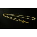 A 9ct gold cross pendant hung on ball link chain, 40cm length, 5.2g total weight