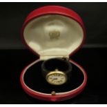 A Cartier "Baignoire" lady's wristwatch, 18ct gold case, Roman numerated oval dial with a sapphire