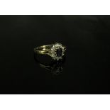 A 9ct gold sapphire and white stone cluster ring. Size L, 1.7g