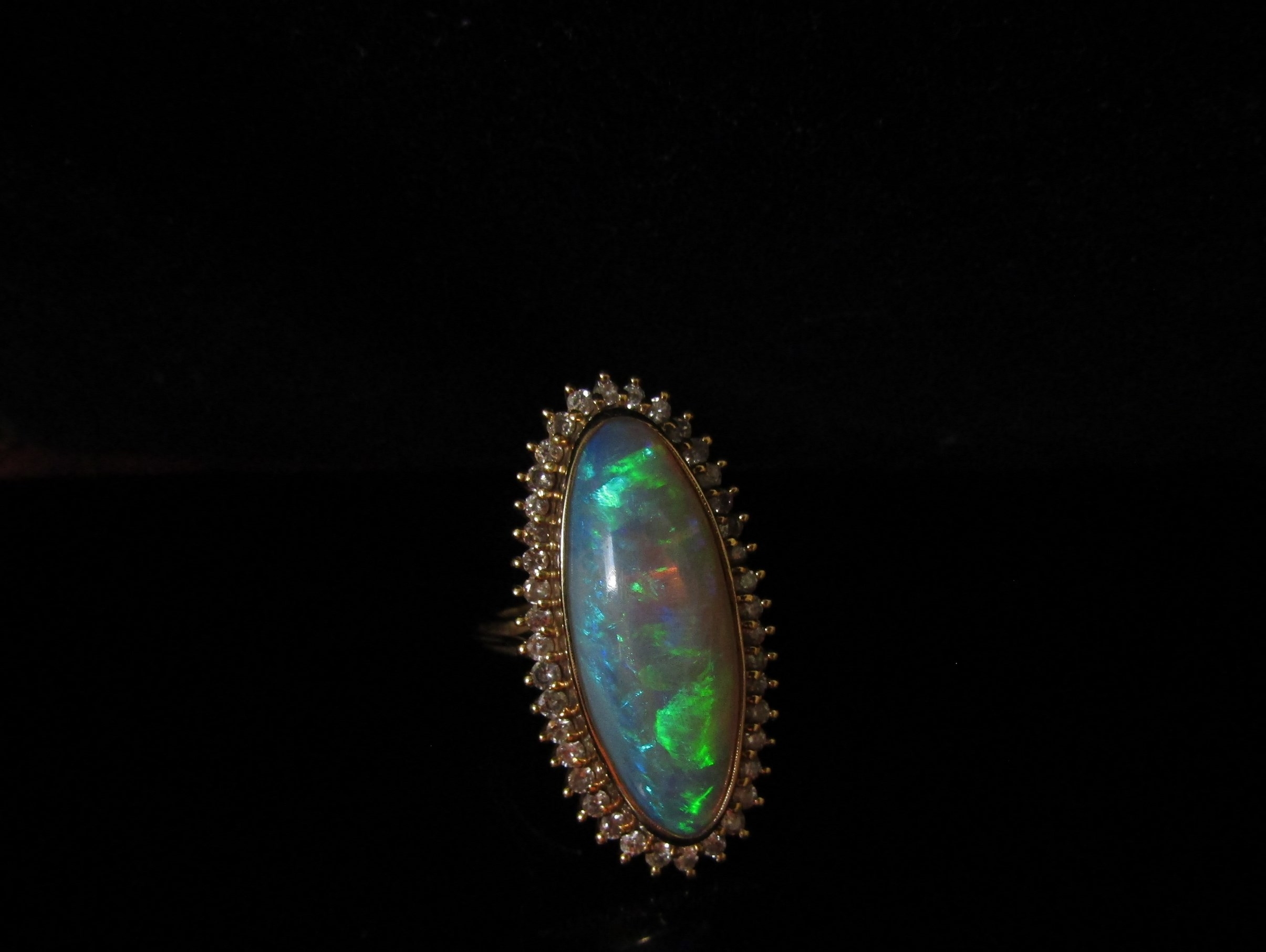 An opal and diamond ring the central oval opal 26.9mm x 10.4mm x 5.4mm, estimated weight 8.87ct - Image 3 of 4