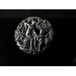 A silver ring made from a button depicting female and putto, 3.3cm diameter. Size N, 7.3g