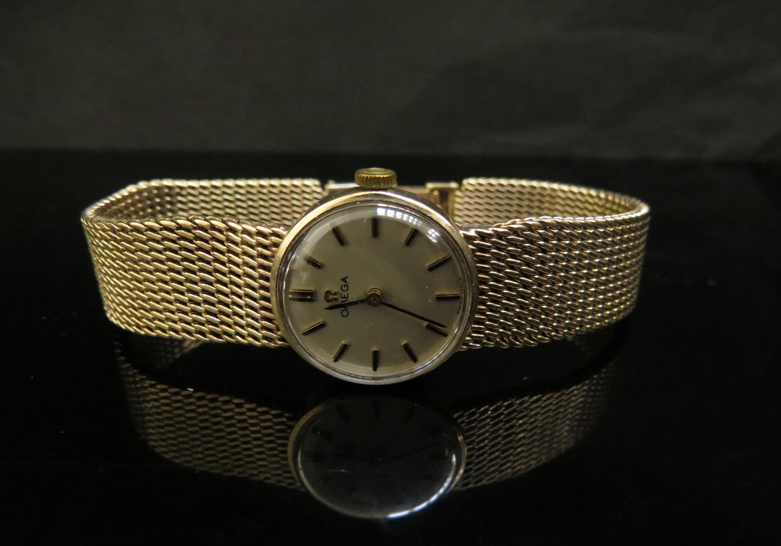 A lady's 9ct gold Omega wristwatch with bracelet strap, 30g