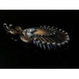 A Victorian memoriam pendant the French jet carved as a shell with gold metal work studded with