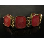A Victorian bracelet with six carved intaglio panels depicting busts of gentlemen, 20cm long