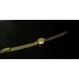 A 9ct gold Record lady’s wristwatch, gold bracelet, winder missing, total weight 21.6g