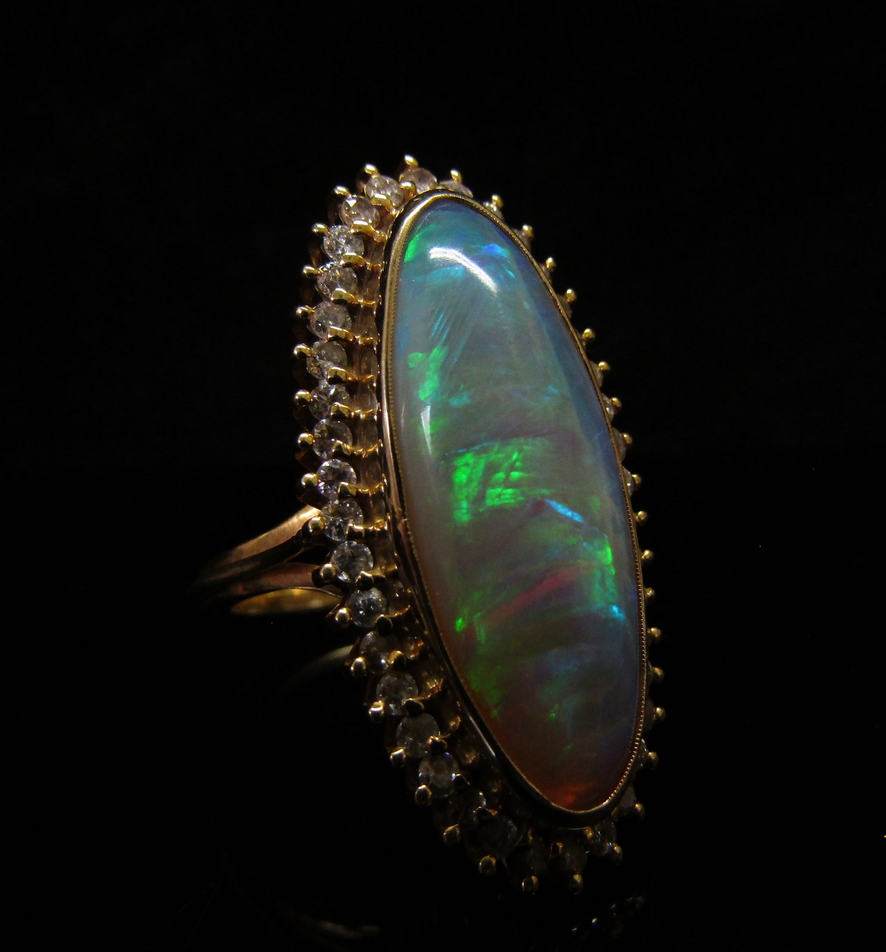 An opal and diamond ring the central oval opal 26.9mm x 10.4mm x 5.4mm, estimated weight 8.87ct - Image 2 of 4