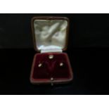 A set of gold studs in fitted case, stamped 18, 9.4g