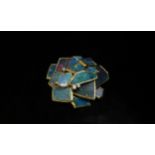 A Cartier modernistic 18ct gold brooch/pendant, with irregular opal slices and three diamonds. In
