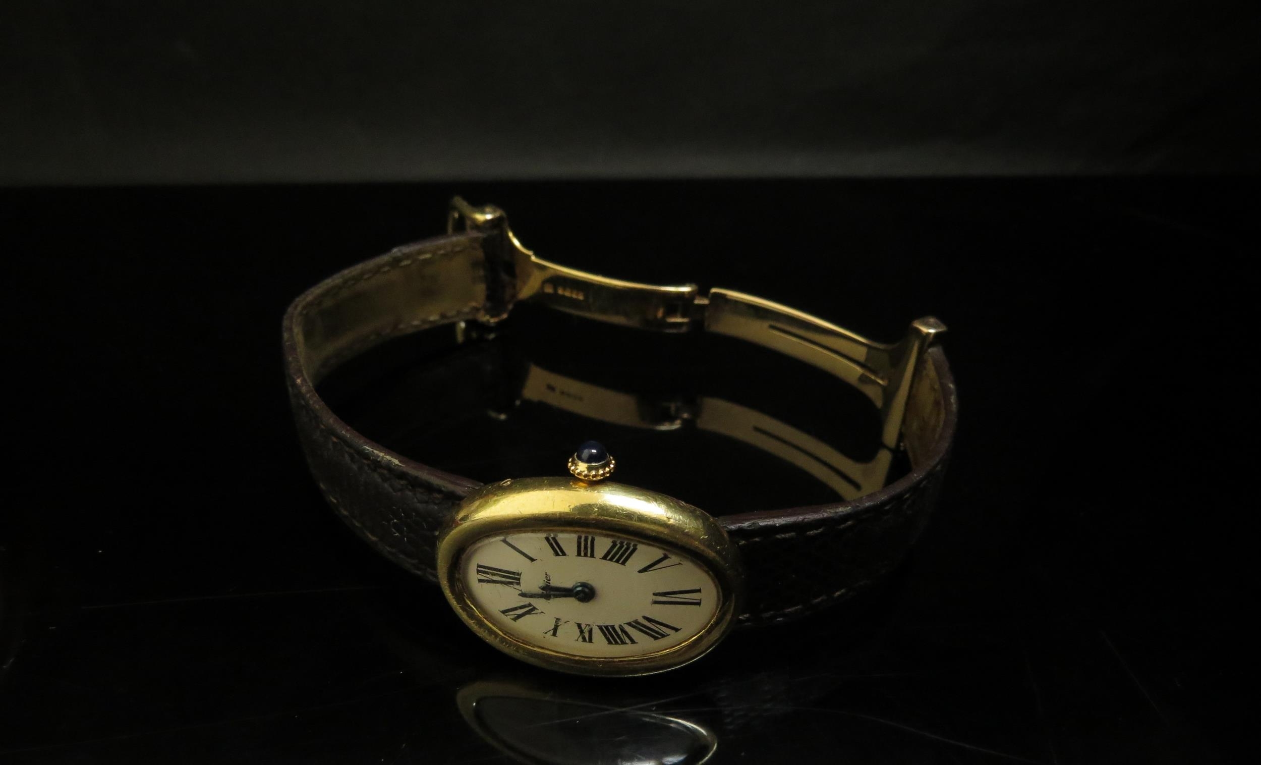 A Cartier "Baignoire" lady's wristwatch, 18ct gold case, Roman numerated oval dial with a sapphire - Image 3 of 5