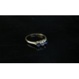 An 18ct gold platinum set diamond and sapphire ring. Size M/N, 1.8g