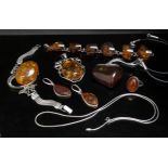 A quantity of Amber jewellery necklaces, earrings and pendants