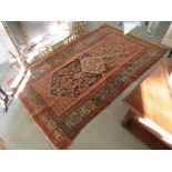 An early 20th Century handwoven Persian rug, 214cm x 120cm