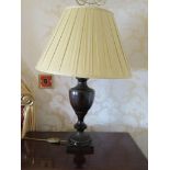 A pair of modern antiqued bronze effect metal brass form lamps with pleated cream shades, 67cm tall,